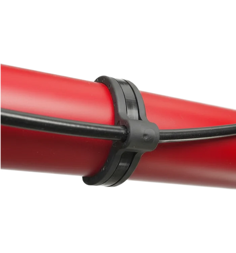 Flexroute TPV rubber line clamp and cable tie guide securing tubing and wire harnesses.