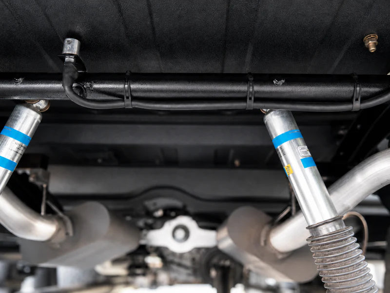 Flexroute TPV line clamp organizing fluid lines and cables along a vehicle undercarriage.