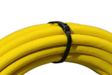 Cobra low profile cable tie showing a smooth, snag-free finished head after being trimmed around yellow hoses.