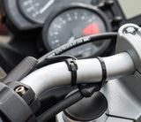 Black Cobra low profile zip ties neatly securing control cables and brake lines along motorcycle handlebars.